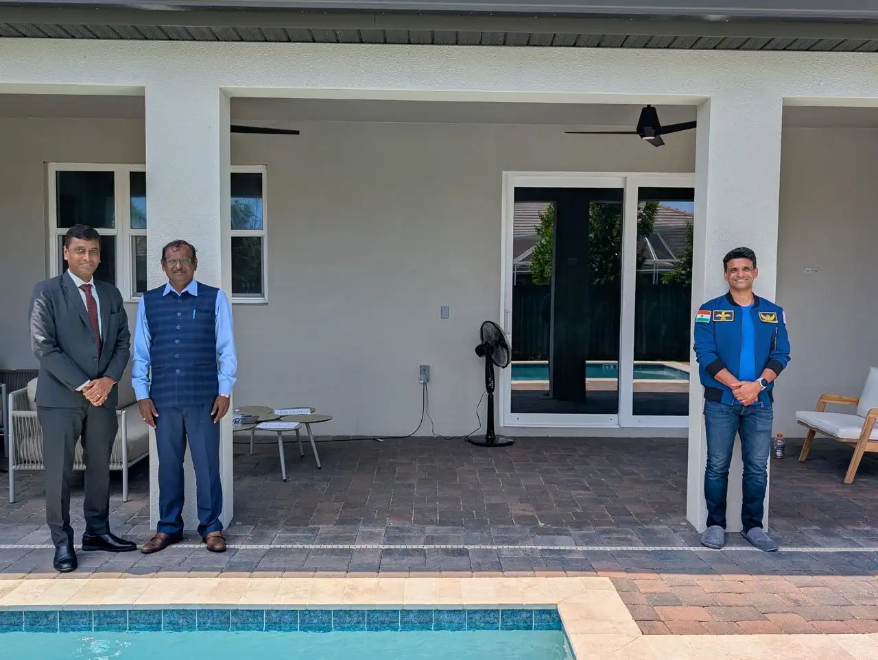 Gaganyatri Shubhanshu Shukla with ISRO Chairman & ISRO Officials prior to space travel at a quarantine facility in the US. Gaganyatri was at a safe distance due to quarantine protocol
                                        