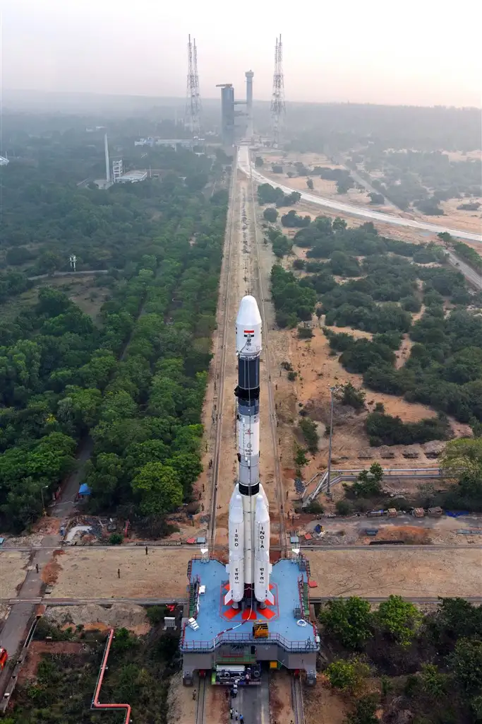 A view of GSLV-F08 vehicle on the Mobile Launch Pedestal proceeding towards the Umbilical Tower seen the background